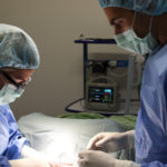 Dr. Michael and Kathy in surgery